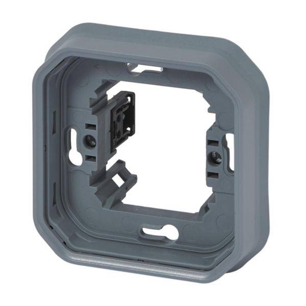 Boîtier carré gris en plastique pour montage mural, avec plusieurs ouvertures pour vis. Utilisé pour l'installation d'interrupteurs électriques ou de prises de courant.