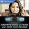 Une personne sourit à la caméra. En dessous, une webcam portant l'inscription « 1080P FHD Capture vidéo avec capteur CMOS 2,1 MP ».