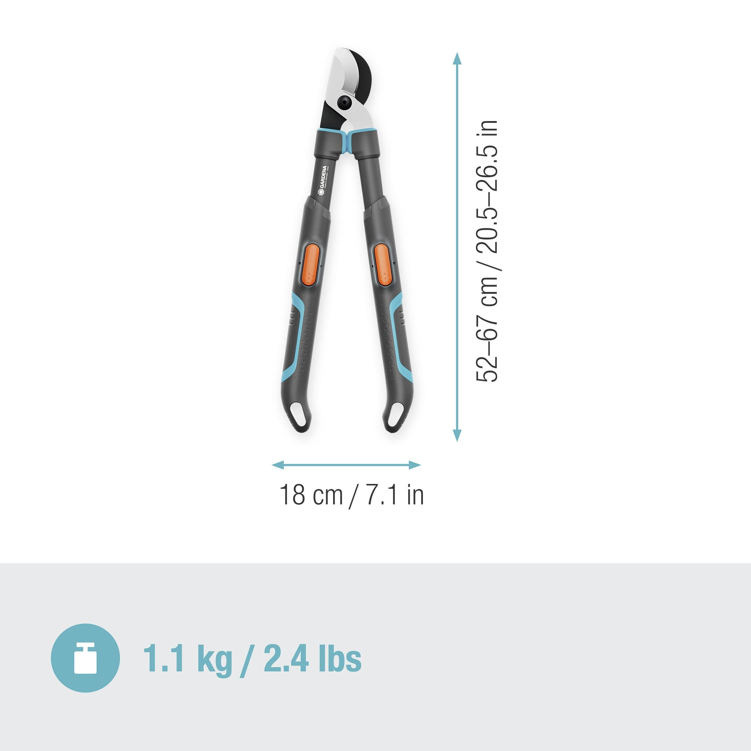 Sécateur avec poignées ergonomiques et longueur réglable de 52 à 67 cm. Poids : 1,1 kg. Échelle de mesure indiquant les dimensions en cm et en pouces.