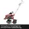 Motoculteur rouge avec guidon rabattable pour un rangement peu encombrant.