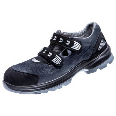 Chaussure de sécurité noire avec deux fermetures velcro et semelle grise, adaptée aux environnements de travail nécessitant une sécurité renforcée.