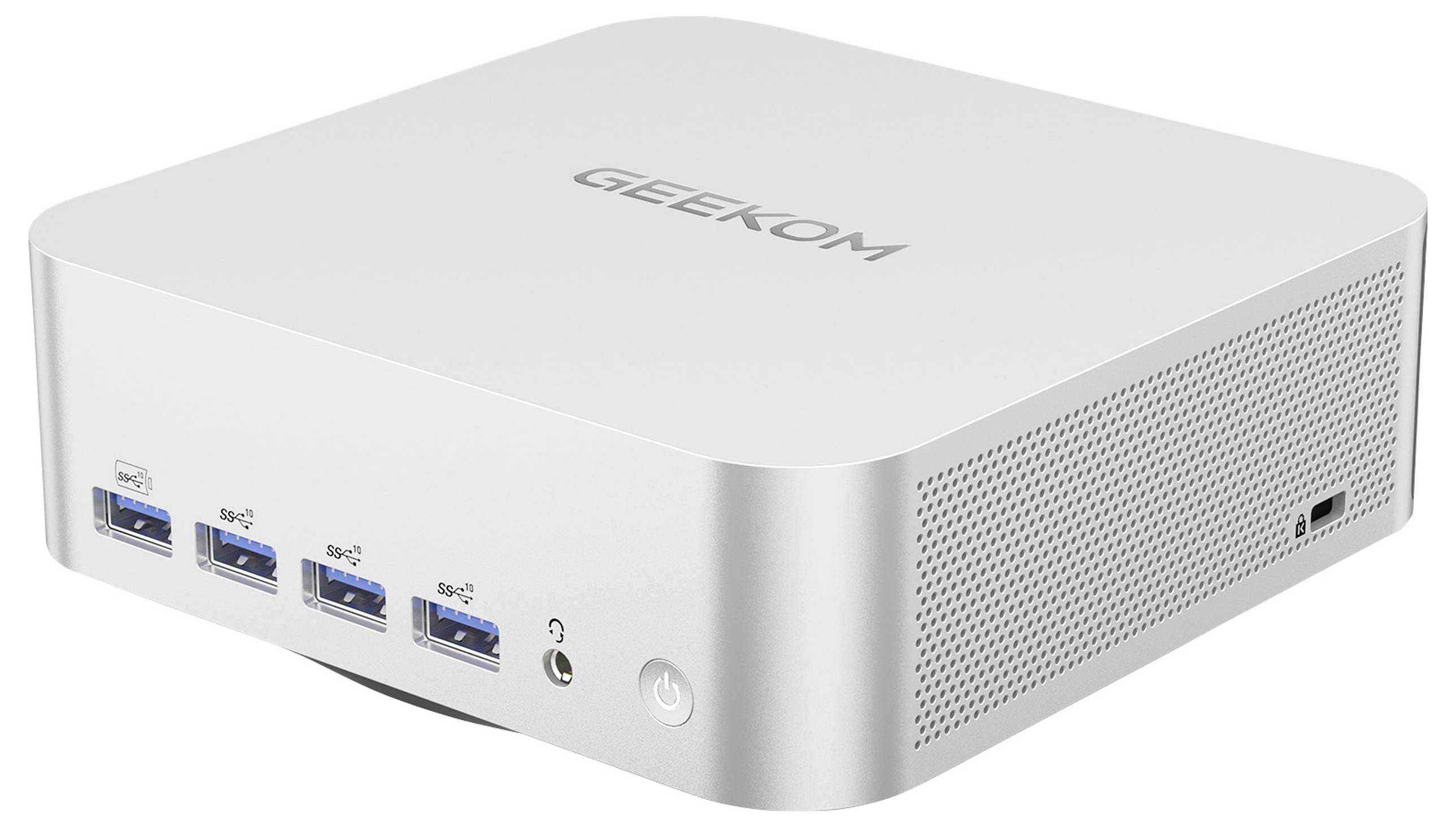 Un mini-PC compact portant le nom de marque 'Geekcom' sur sa face supérieure. Quatre ports USB et une prise casque sont visibles.