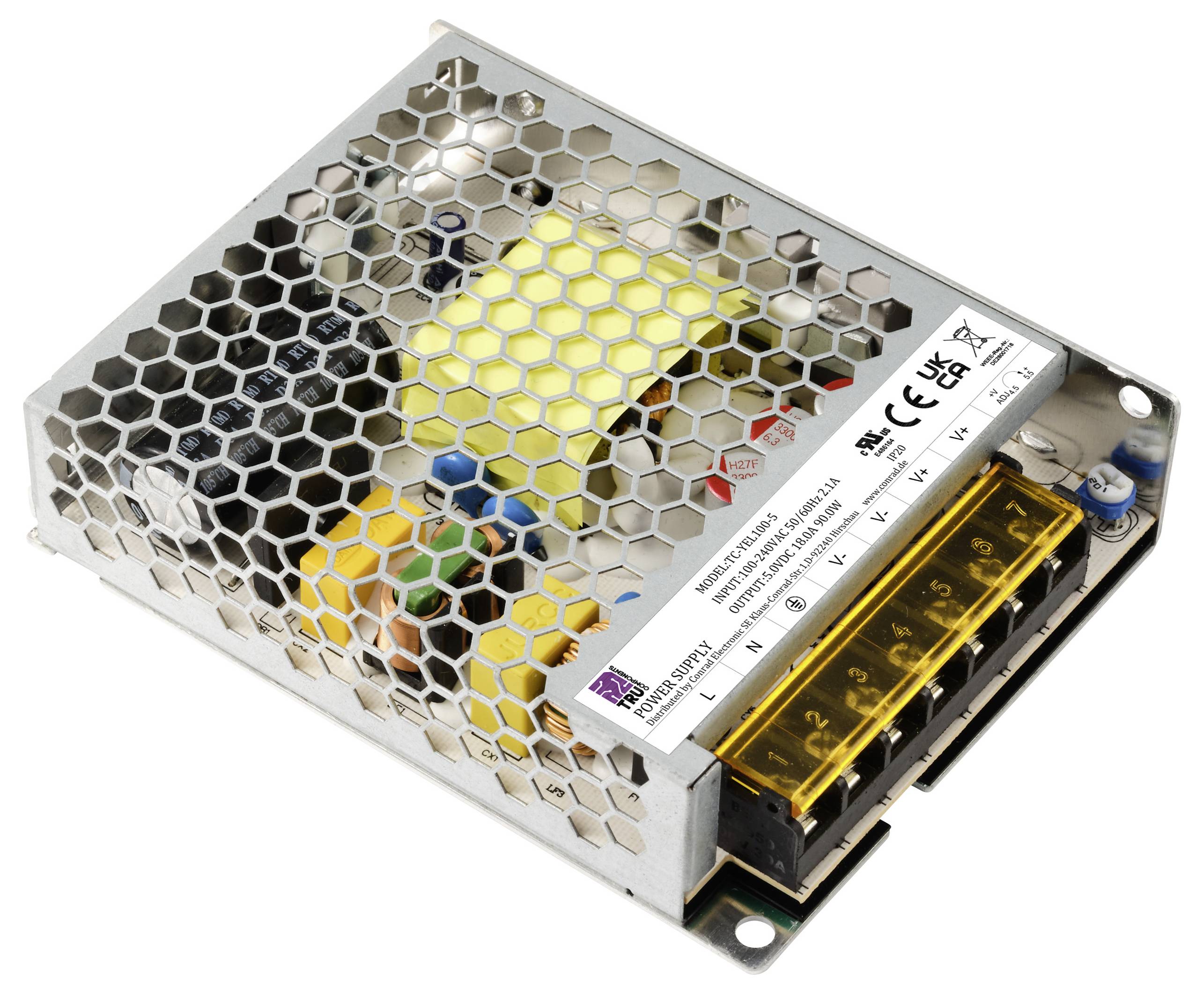 Boîtier métallique d'une alimentation électrique au motif en nid d'abeille, composé de plusieurs composants colorés à l'intérieur et de bornes de sortie marquées en jaune.