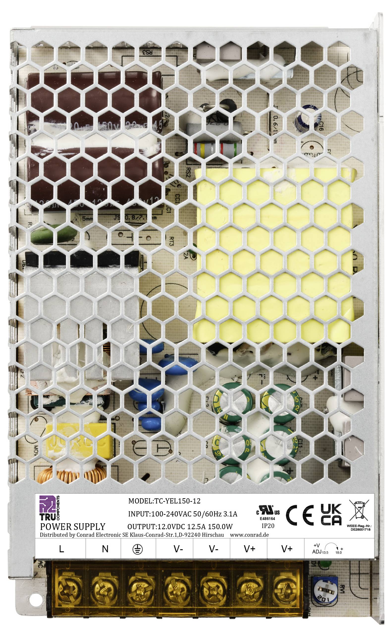 Un bloc d'alimentation ouvert avec un motif quadrillé met en évidence les composants électroniques internes et les informations techniques sur une étiquette à l'avant.