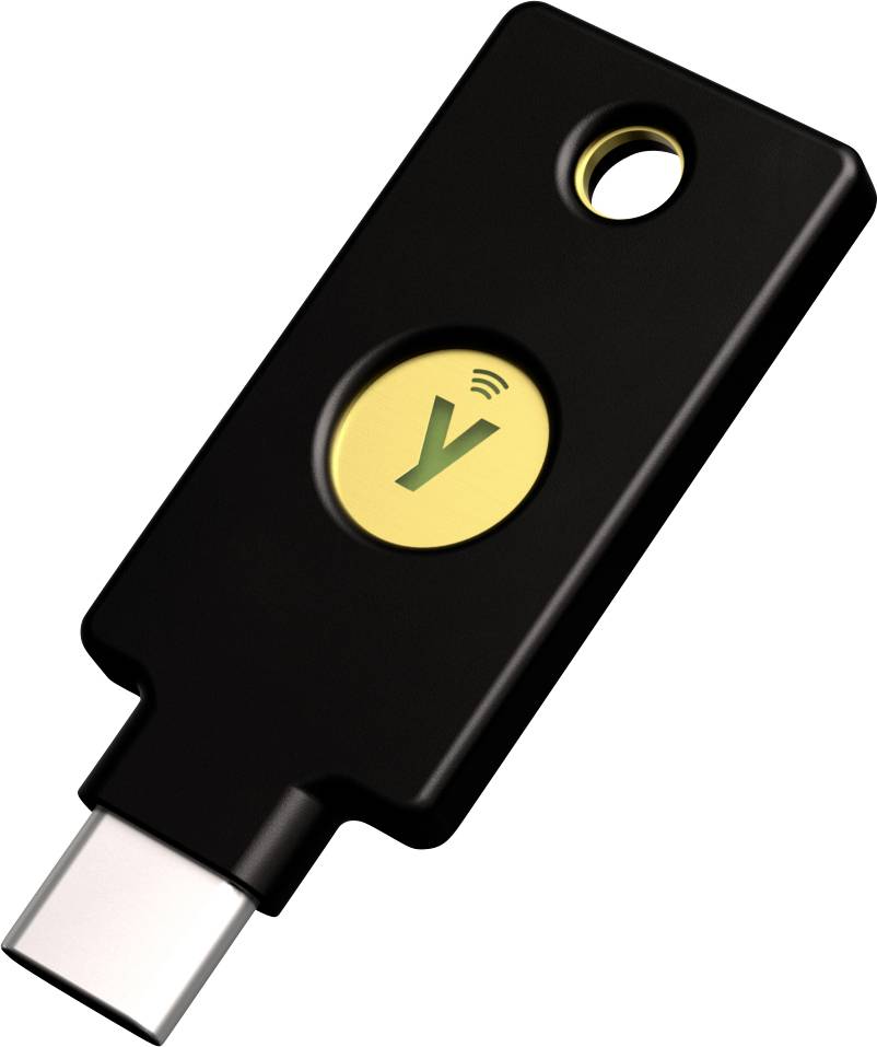 Clé de sécurité USB noire avec un cercle jaune et un symbole au centre, utilisée pour l'authentification à deux facteurs.