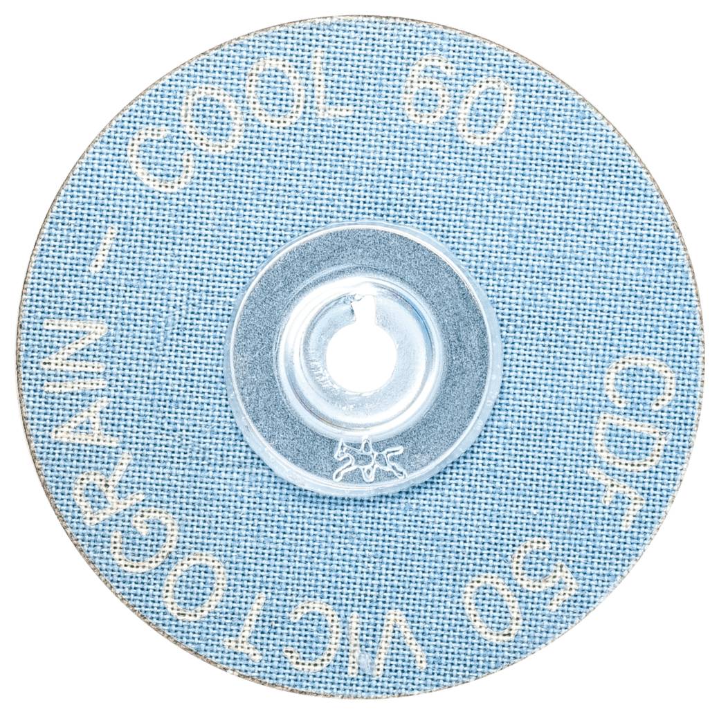 Un disque abrasif circulaire avec une surface bleue, portant l'inscription 'COOL 60' et 'VICTOGRAIN 50 CDF'. Un trou central pour la fixation.