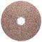 Disque de meulage en matériau abrasif brun, avec un trou central pour la fixation sur une machine à meuler, destiné à la finition de surfaces lisses.