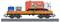 Un train miniature avec un chargement de plateforme, composé d'un camion-poubelle orange 'Clean is Green' et de deux conteneurs de recyclage bleus.