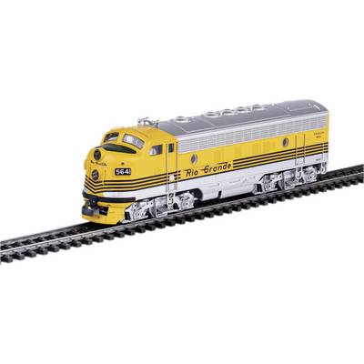 Une locomotive jaune et noire de la 'Rio Grande' roule sur des rails, présentant un design aérodynamique avec un toit gris.