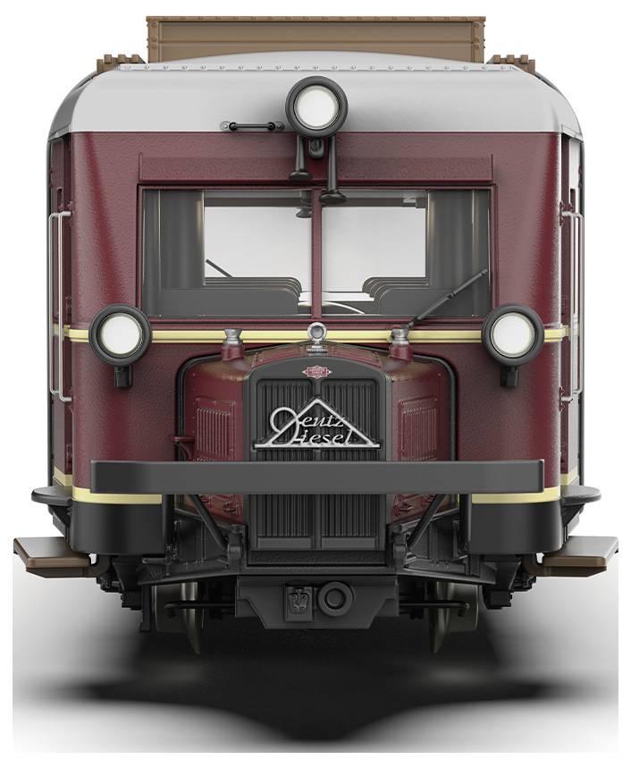 Un autorail historique rouge portant l'inscription 'Diesel' sur sa façade. Design rétro avec de grands phares et une forme rectangulaire.