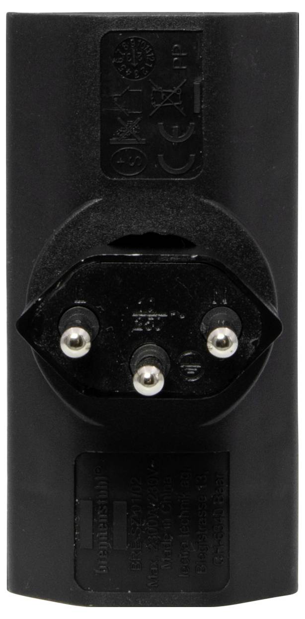 Adaptateur électrique noir avec trois broches métalliques disposées en forme de pyramide sur la face avant et marquage en relief sur le dessus.