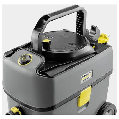 Un aspirateur gris avec une poignée noire et des touches jaunes, un interrupteur marche/arrêt sur le côté, et un logo de marque sur l'avant.
