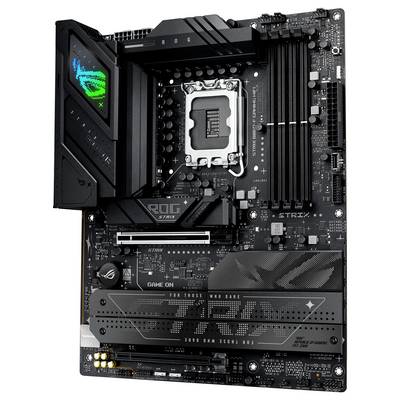 Une carte mère noire avec différents composants, comprenant des emplacements RAM, un socket processeur, des dissipateurs thermiques et des détails de marque.