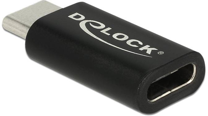 Un adaptateur USB-C noir de la marque Delock est posé en diagonale.