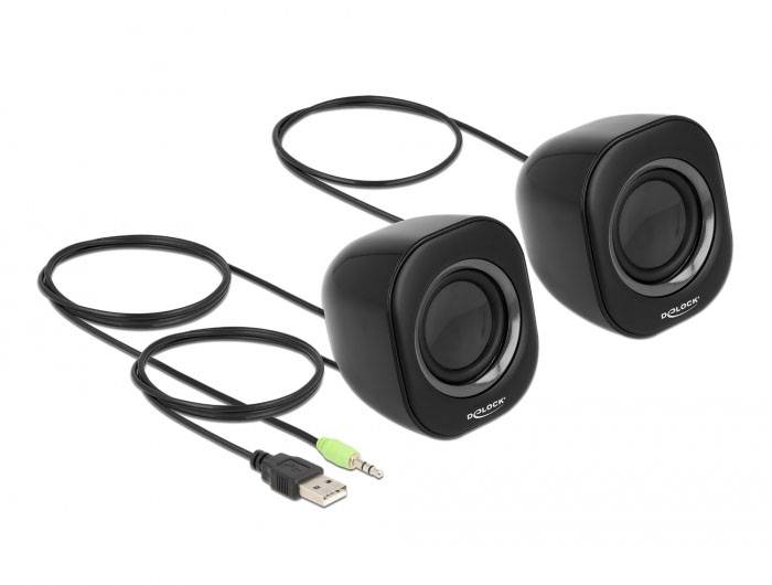 Deux enceintes noires avec des câbles, une connexion USB et une prise audio verte. Design simple et compact pour ordinateur.
