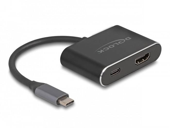 'Un adaptateur USB-C avec ports HDMI et USB-A. L'appareil est noir avec un court câble se terminant par une fiche USB-C.'