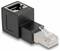 Un adaptateur Ethernet noir avec une prise femelle sur un côté et une prise mâle sur l'autre, servant à établir une connexion réseau.