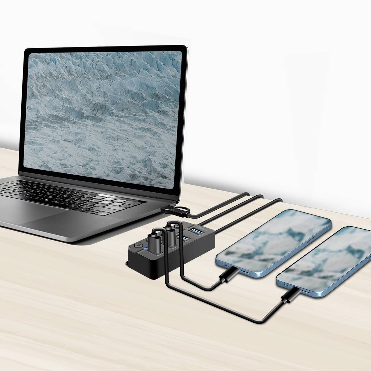 Un ordinateur portable est connecté à plusieurs smartphones posés sur une table. Tous les appareils sont interconnectés au moyen de câbles.