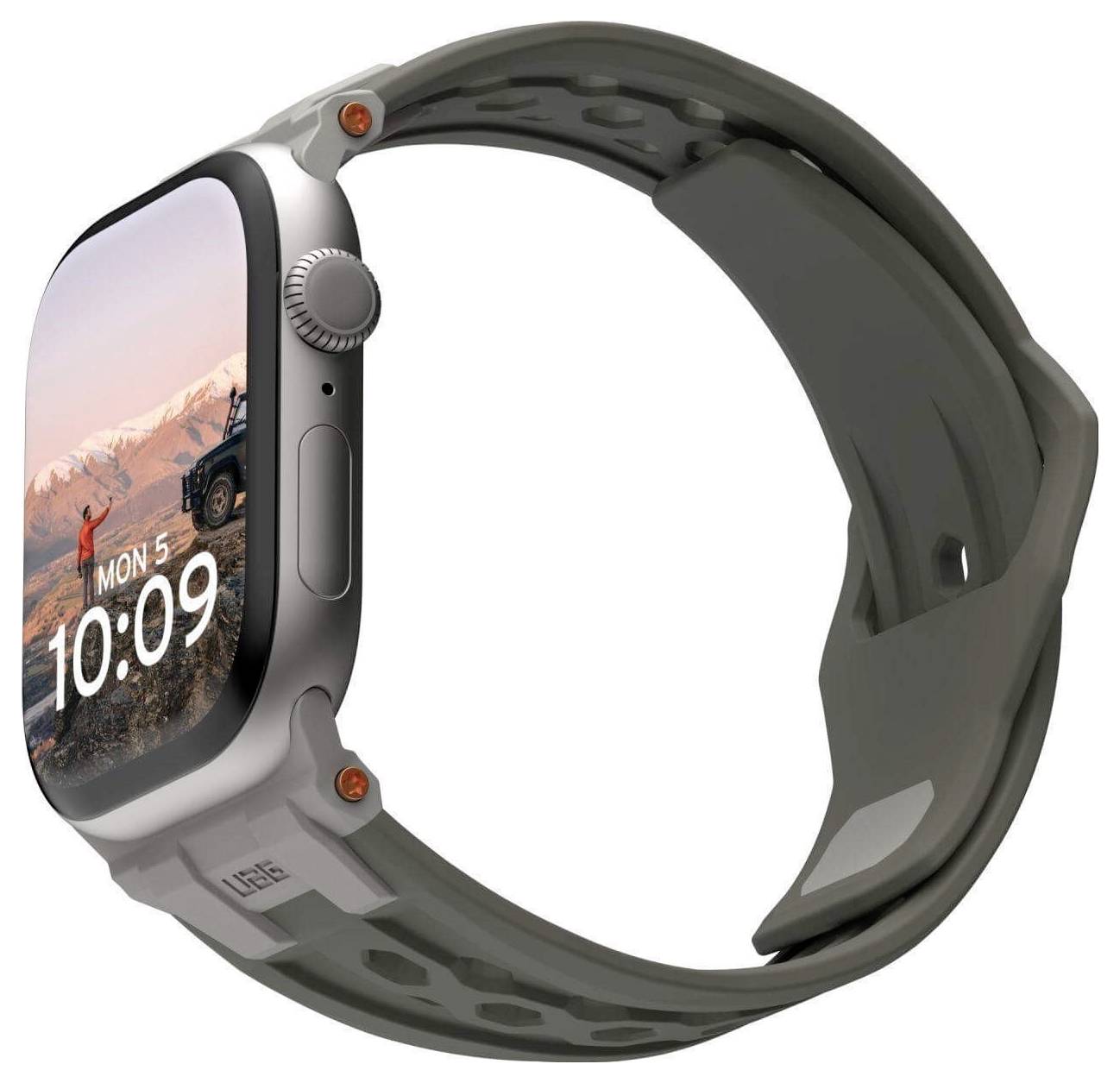 Une montre connectée grise avec une image de montagnes sur l'écran et l'heure affichée '10:09'. Boîtier et bracelet au design robuste.
