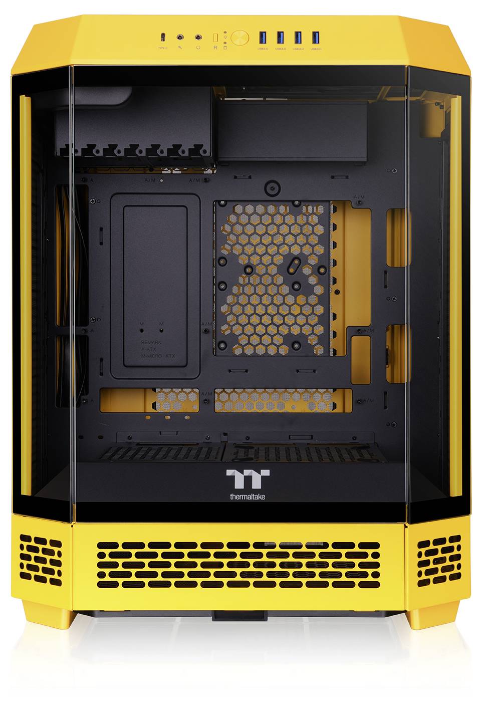 Boîtier d'ordinateur jaune avec façade et côtés en verre, intérieur apparent pour l'installation de composants matériels.