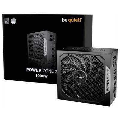 Un bloc d'alimentation noir be quiet! Power Zone 2 de 1000W, montrant le ventilateur et les connecteurs ; l'emballage est visible en arrière-plan.