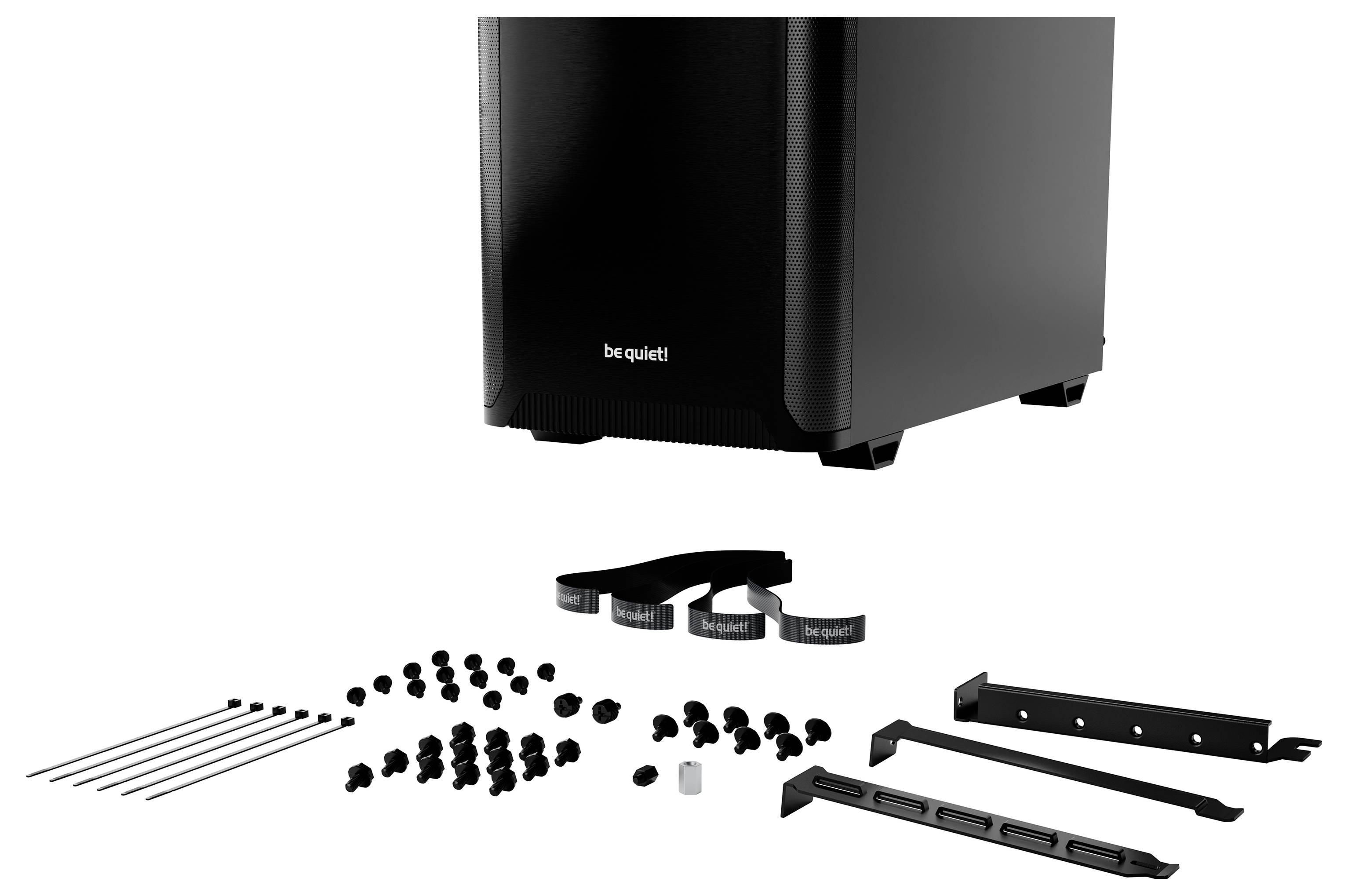 Un boîtier d'ordinateur noir de 'be quiet!' avec des accessoires tels que des vis, des attaches de câbles et des supports disposés devant.