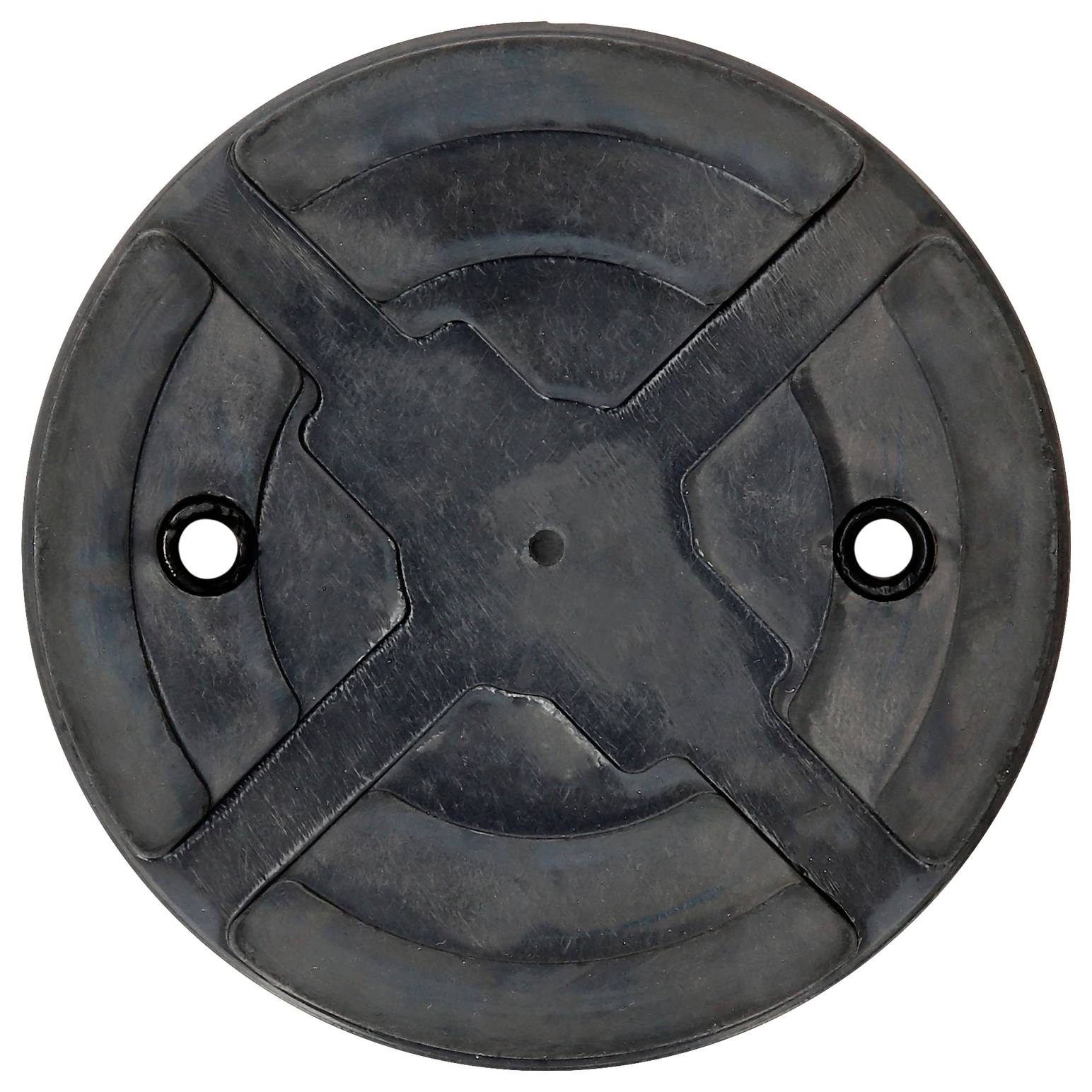 Un disque de caoutchouc robuste et rond, doté de deux trous centraux. Sa surface présente des renforcements en relief en forme de croix.