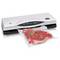 Appareil de mise sous vide de FUTURA MAGICVAC avec une tranche de viande sous vide, décorée de brindilles de romarin. Idéal pour la conservation des aliments.