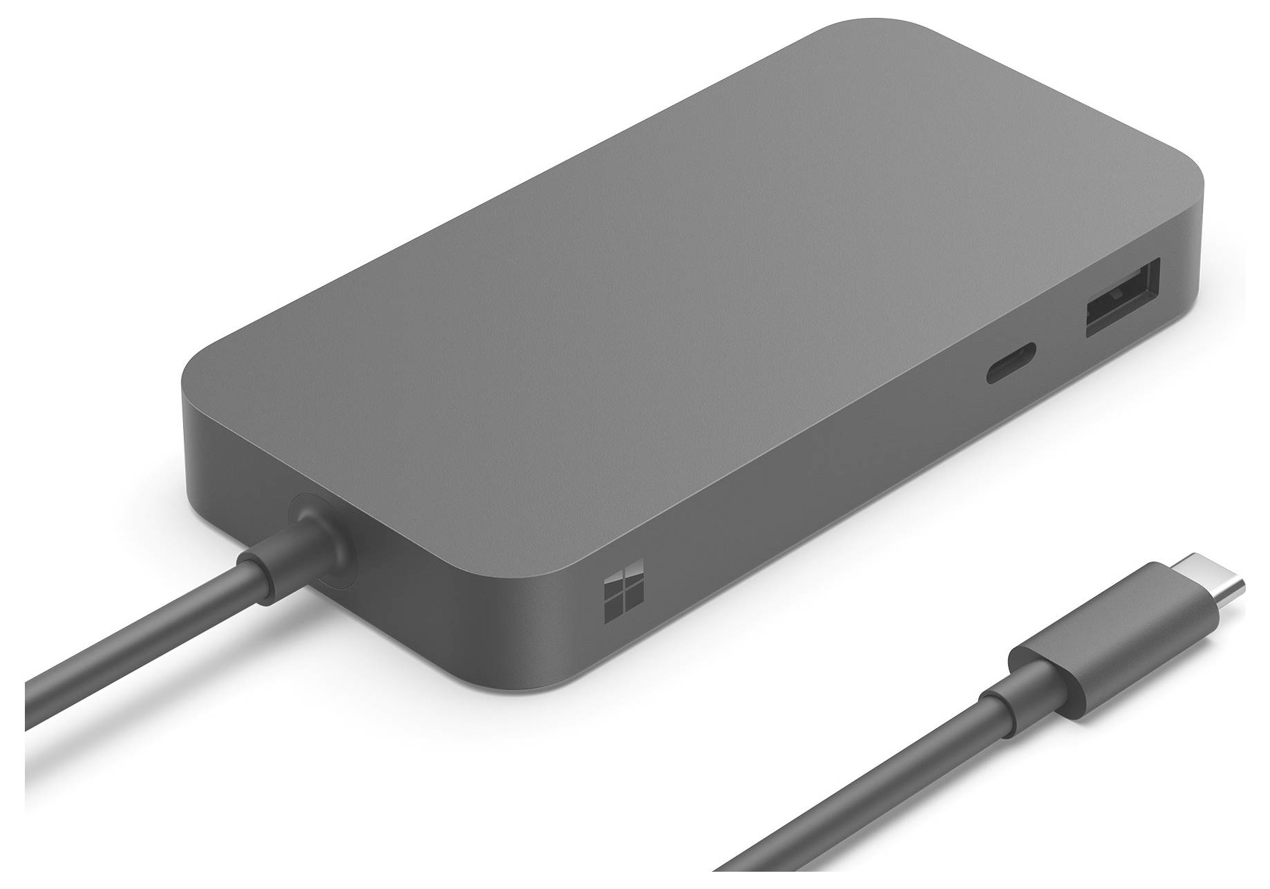 Un hub USB-C gris avec plusieurs possibilités de connexion, dont un port USB-A. Un câble USB-C est branché.