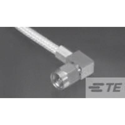 Un connecteur coaxial argenté avec un raccordement coudé est visible. Logo de marque dans le coin inférieur droit.