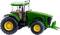 Tracteur jouet vert avec des roues jaunes, inspiré d'un véritable tracteur agricole, présentant un design détaillé.