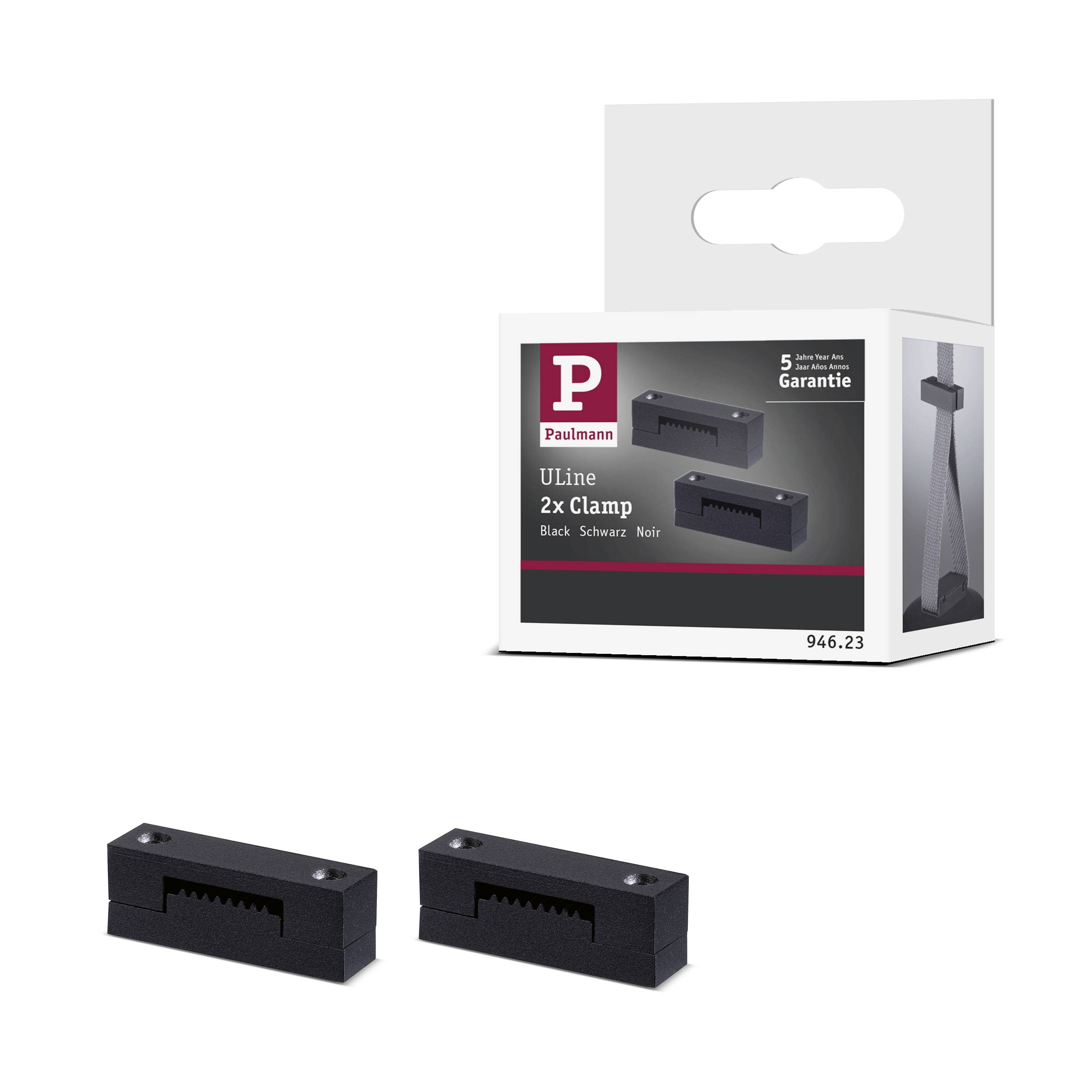 Deux pinces noires devant un emballage portant l'inscription « Uline 2x Pince, Noir, 5 ans de garantie ». Emballage en noir et blanc.