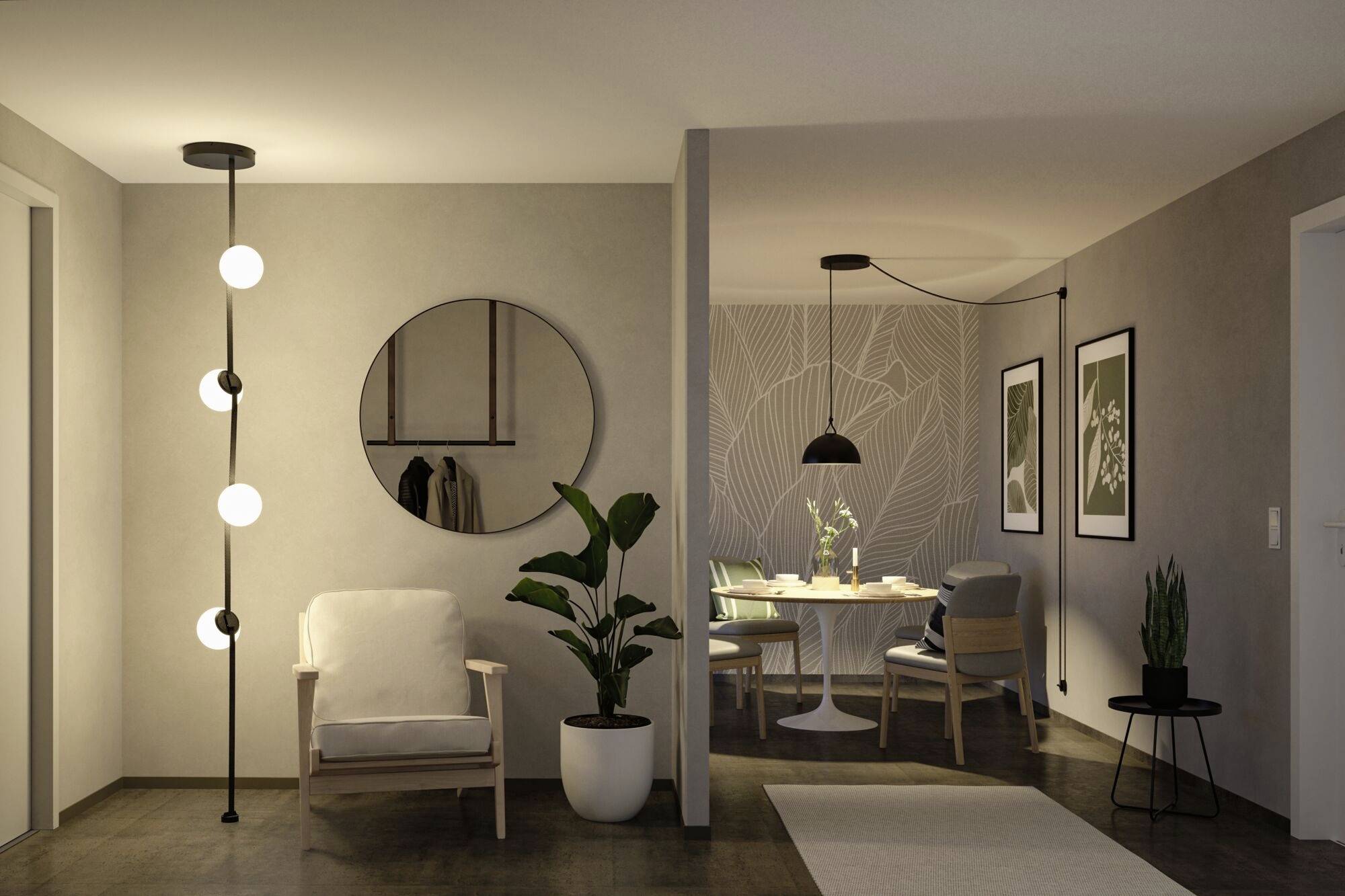 Un salon au design moderne avec un fauteuil, des plantes et un miroir rond. À l'arrière-plan, un espace repas avec une suspension.