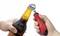 « Une bouteille s'ouvrant à l'aide d'un décapsuleur rouge à poignée noire, évoquant un sentiment de préparation pour une boisson. »