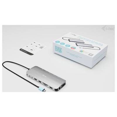 Un dock USB-C avec plusieurs ports et un câble USB est posé devant son emballage et son mode d'emploi.