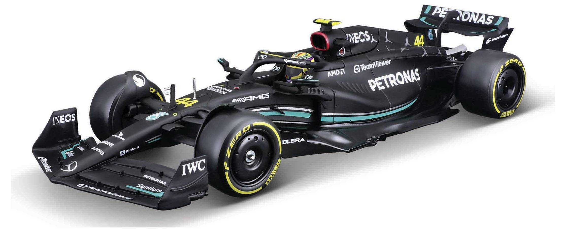 Une voiture de Formule 1 noire avec le logo Petronas, des marquages de pneus jaunes et le numéro 44. Elle présente un design élégant et aérodynamique.