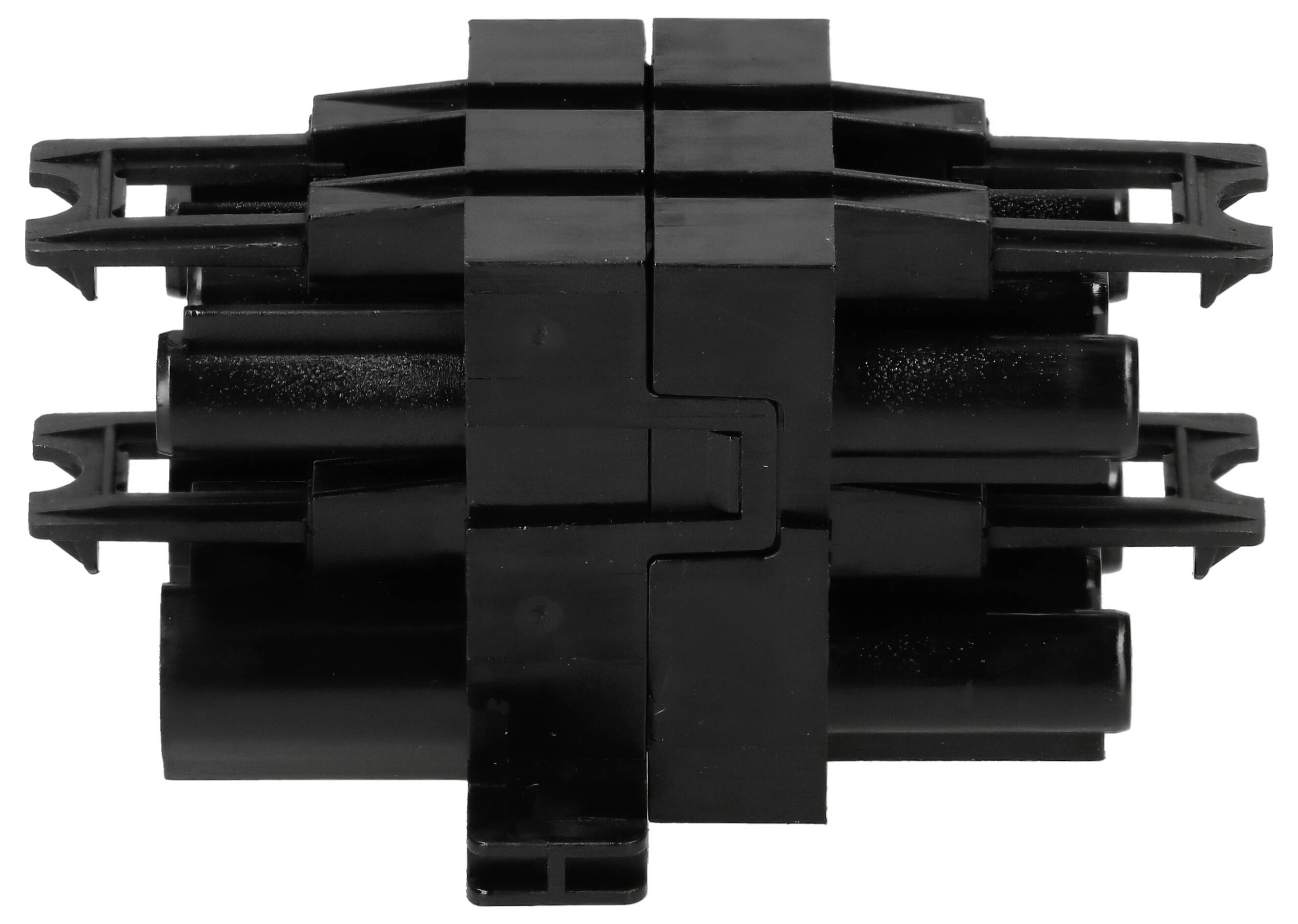 Condensateur en film plastique noir disposé en motif croisé, adapté au montage THT sur circuit imprimé.