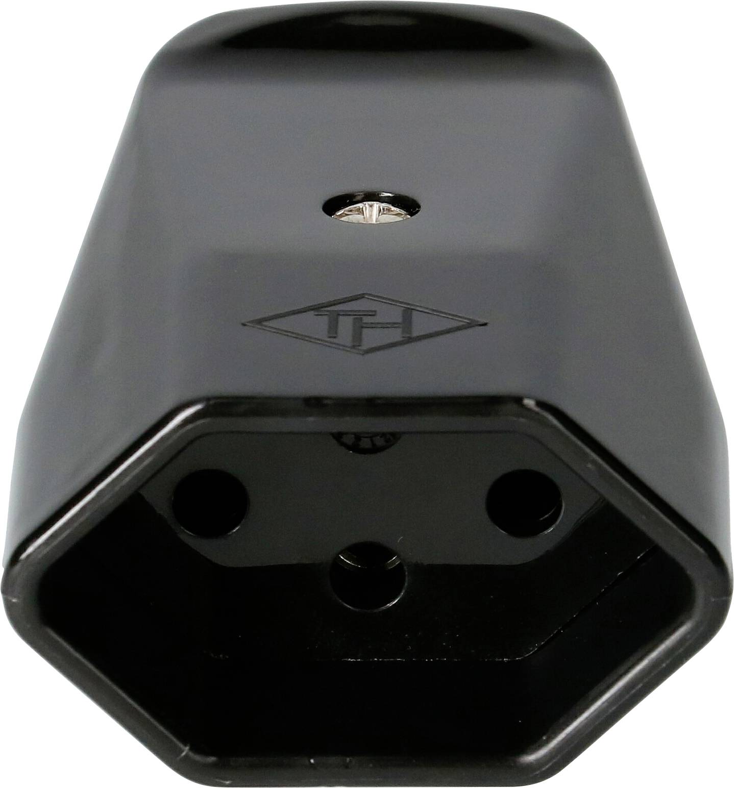 Un adaptateur de prise hexagonal noir avec un petit trou en haut et un logo d'entreprise au centre.