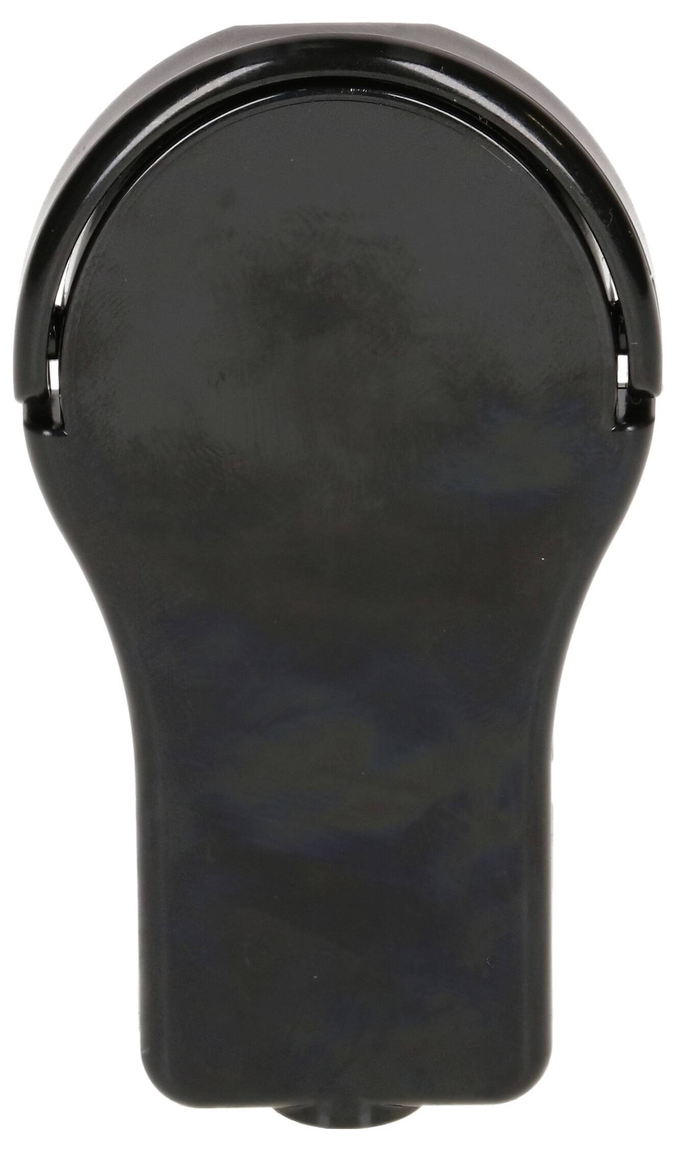 Un appareil ou boîtier simple, noir et ovale avec une surface lisse, placé au centre de l'image.