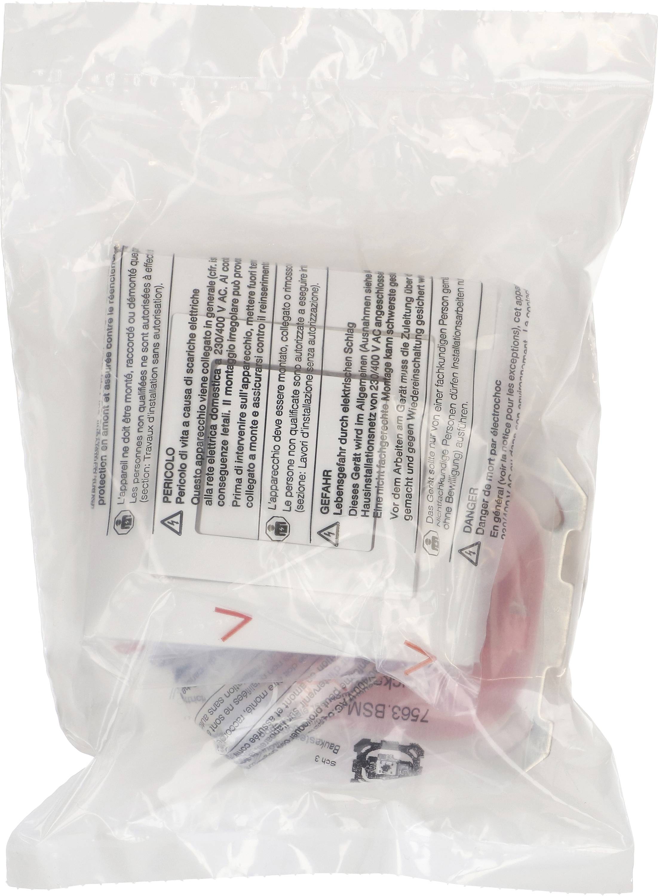 Un sac en plastique transparent et fermé contient un petit paquet blanc avec des consignes de sécurité et d'utilisation en plusieurs langues.