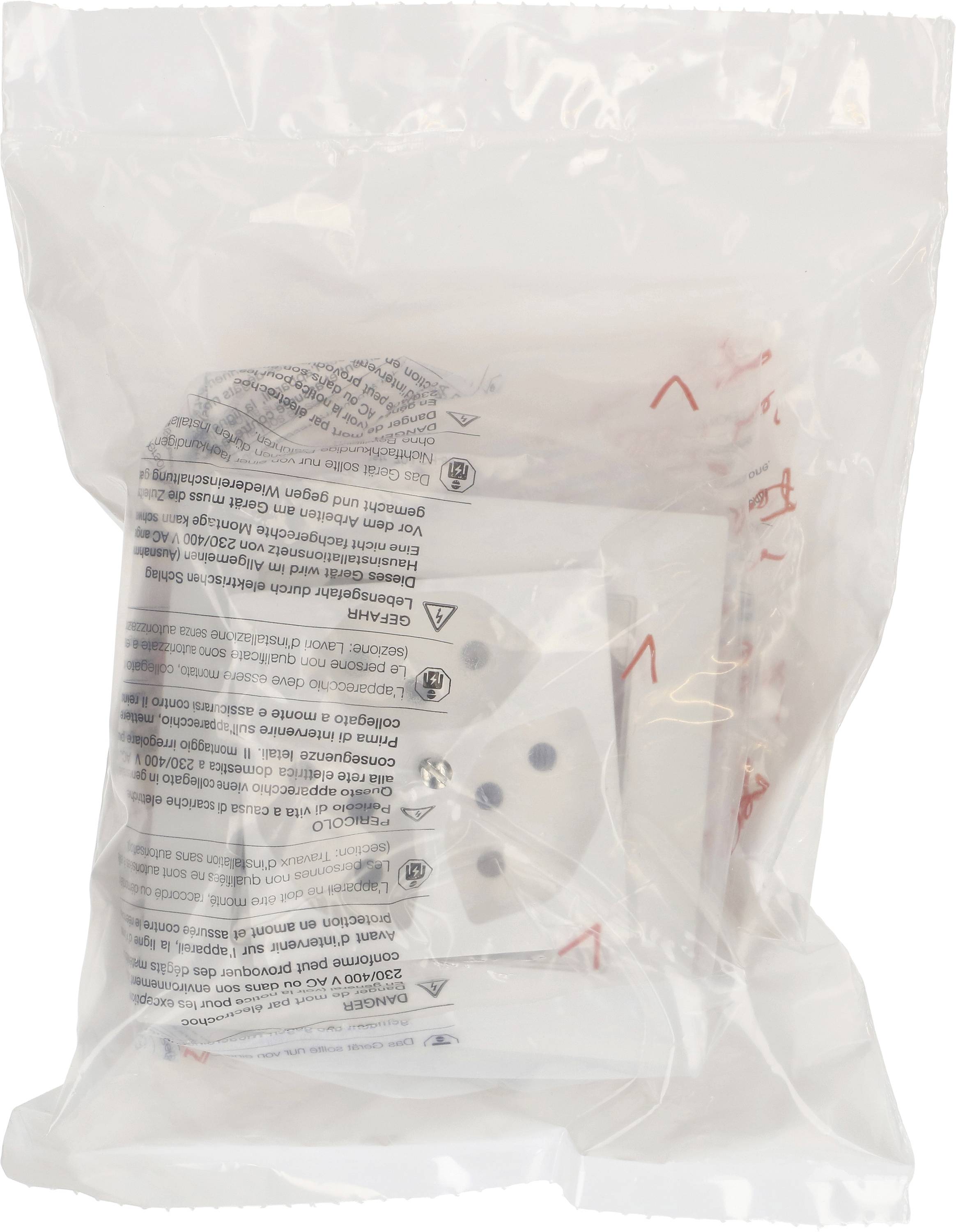 Un emballage en plastique contenant des objets blancs à pois et des informations de sécurité dans plusieurs langues au verso.