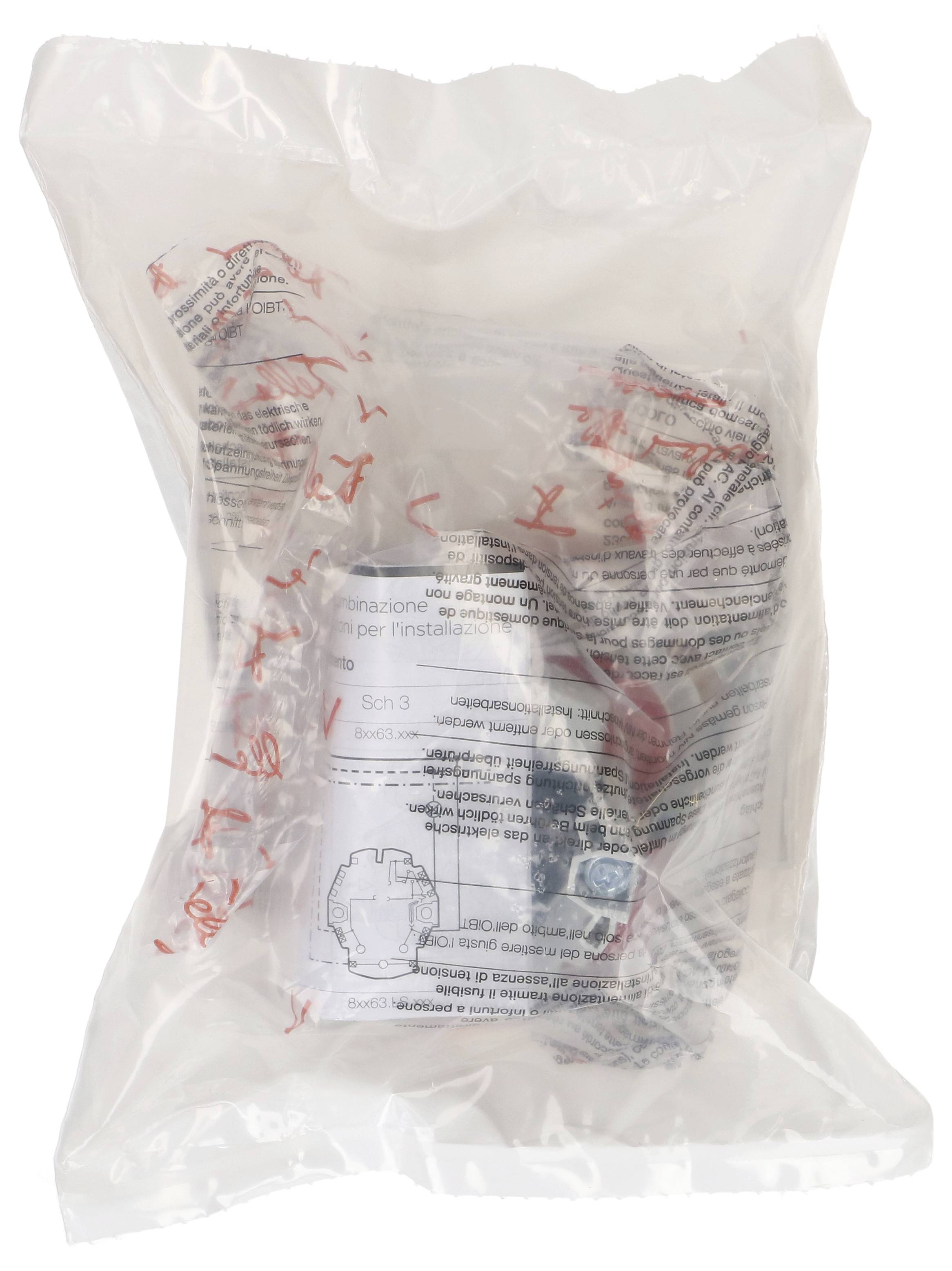 Sac en plastique contenant un appareil enveloppé d'une feuille d'instructions. Texte dans différentes langues sur l'emballage.