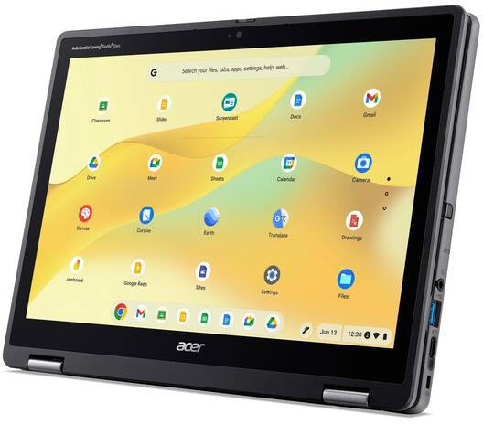 Un Chromebook Acer noir en mode tablette affiche l'écran d'accueil avec différentes icônes d'applications et une barre de recherche.