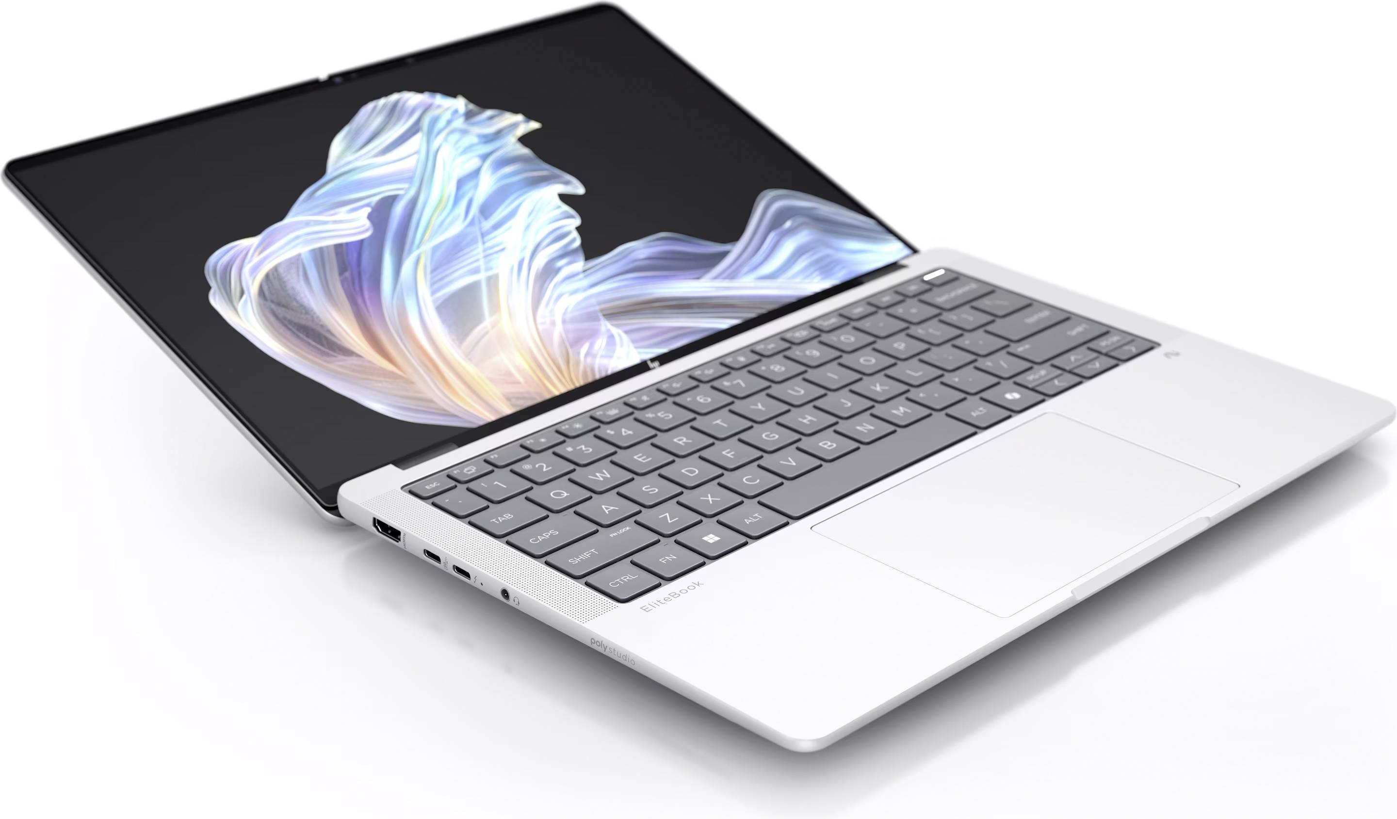 Un ordinateur portable argenté avec le couvercle ouvert affiche une image abstraite et colorée sur l'écran. Le clavier et le pavé tactile sont visibles.