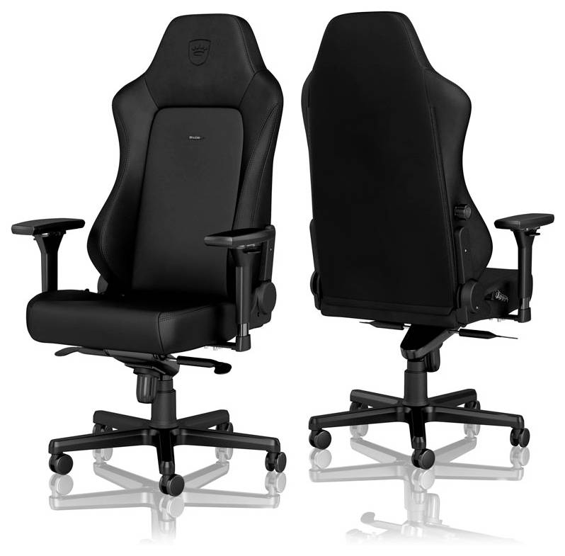 Deux chaises de gaming noires au design ergonomique, avec un dossier haut et des accoudoirs réglables. Idéales pour de longues périodes d'assise.