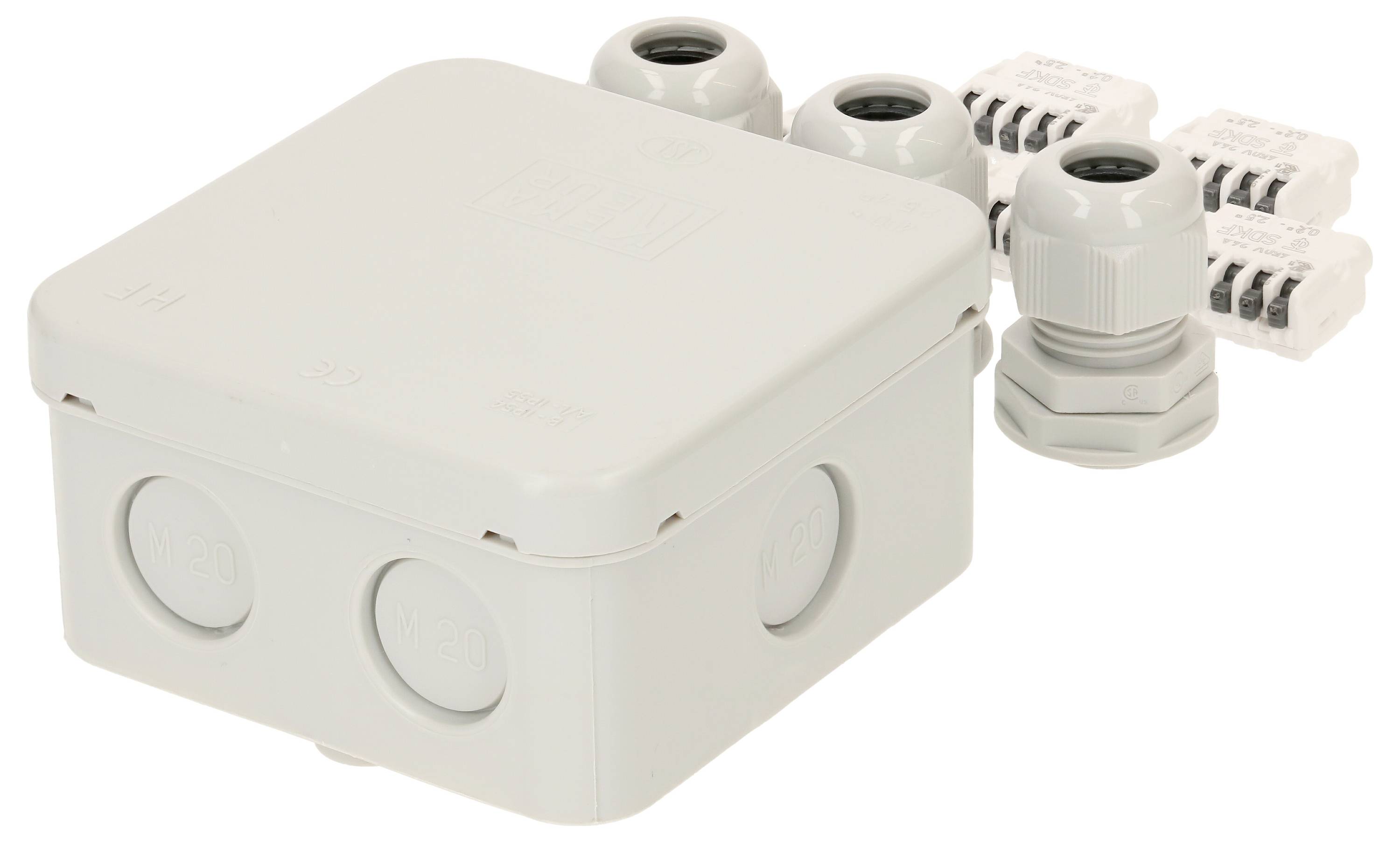 Boîtier de raccordement électrique gris avec plusieurs presse-étoupes et bornes, adapté pour le câblage et les installations.