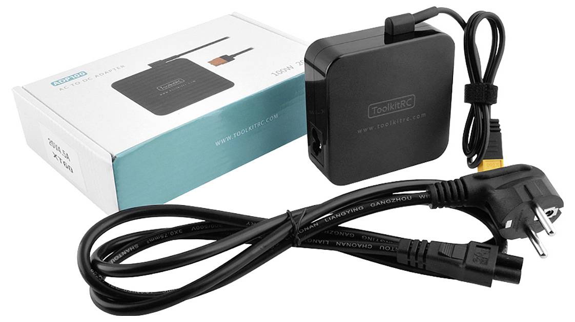 Un chargeur noir avec son câble secteur et son emballage est représenté. L'inscription indique 'ToolKitRC'.