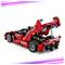 Un modèle réduit de voiture de sport rouge avec un aileron arrière visible et des composants mécaniques détaillés, vu de l'arrière sur un fond blanc.