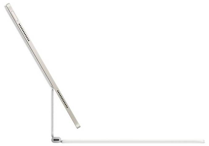 Une tablette est vue de profil, posée sur une housse de clavier blanche qui la maintient verticalement.