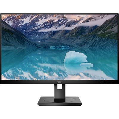 Un moniteur de la marque Philips affiche un paysage impressionnant avec des montagnes et un lac au premier plan sous un ciel nuageux.